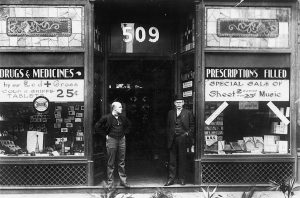 Joseph and George Varden in front of Varden's Drugs