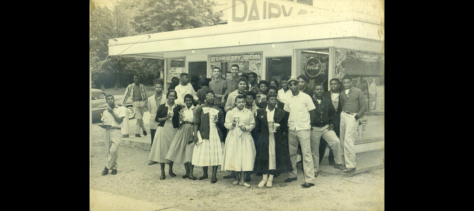 Western High School students from the class of 1958, standing in front of an ice cream parlor.